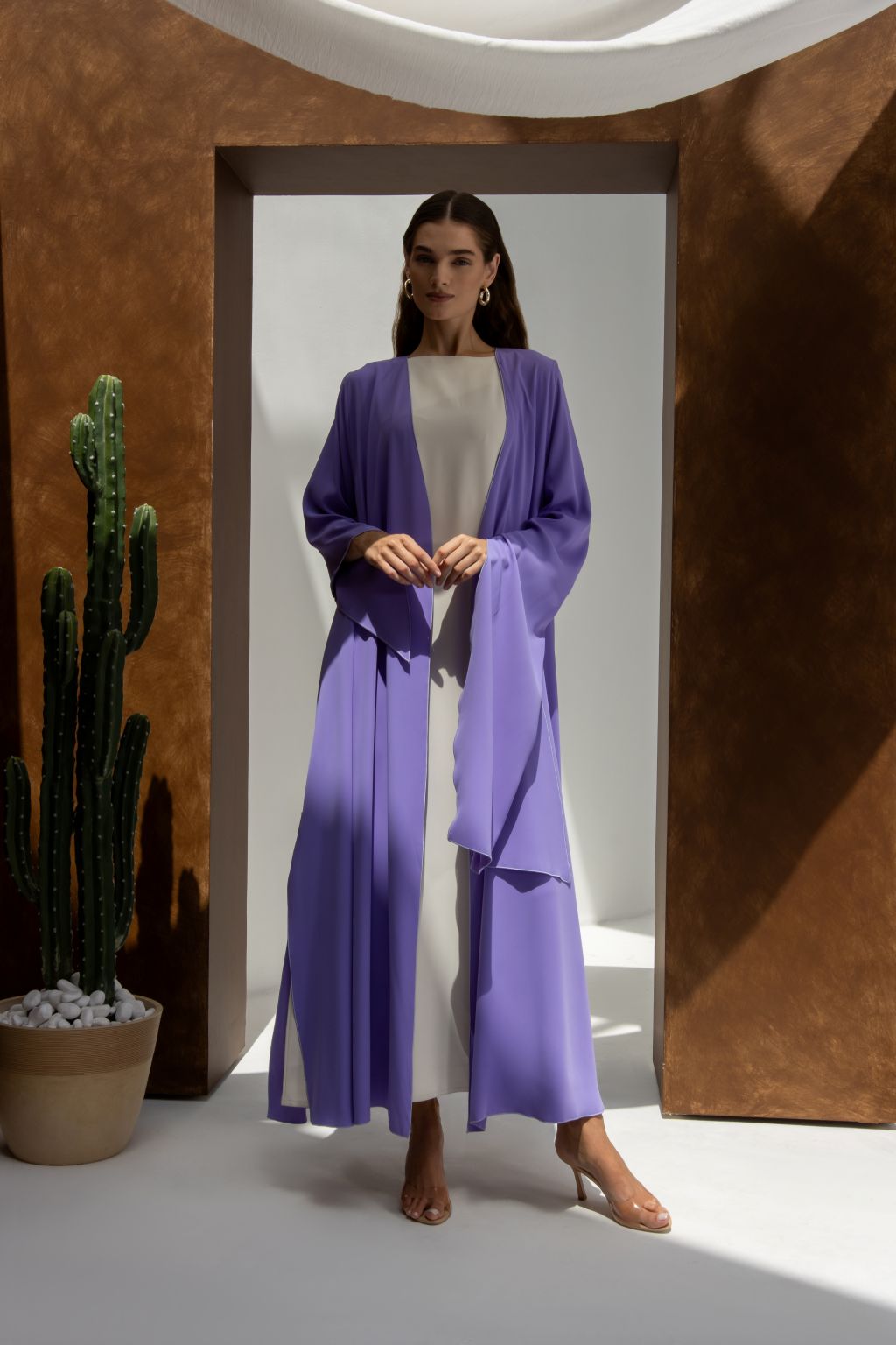 Woman wearing Selected Lines Onz SLC Signature robe in lavender over white dress with open front design