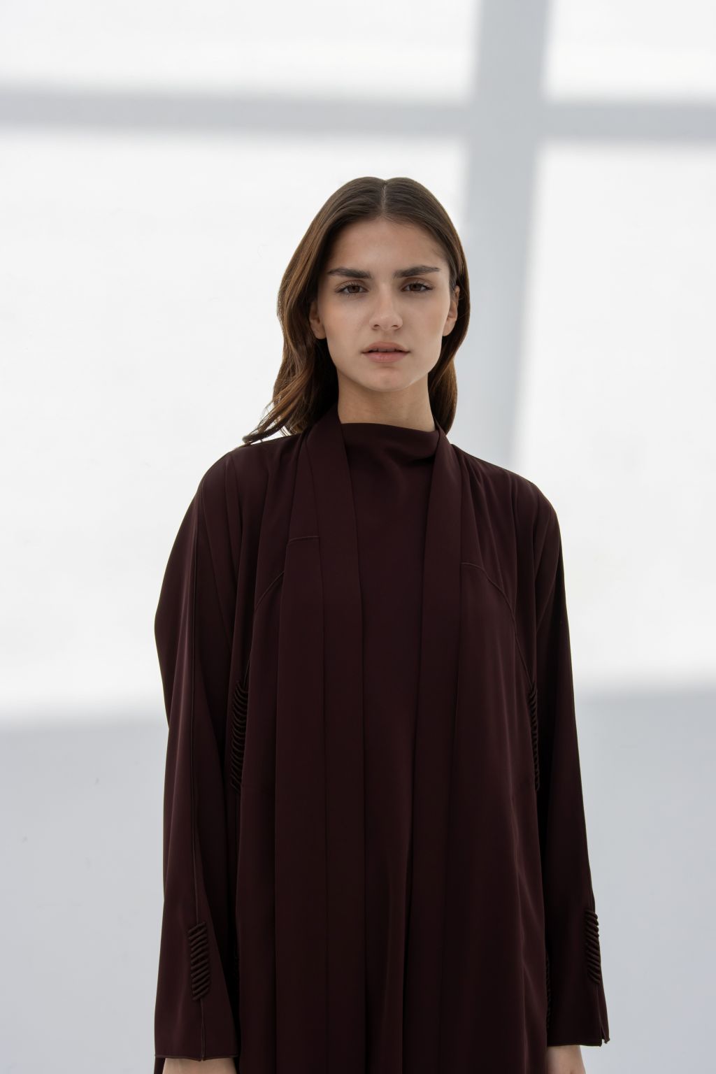 Elegantly designed burgundy premium handcrafted abaya with stylish detailing for modest fashion.