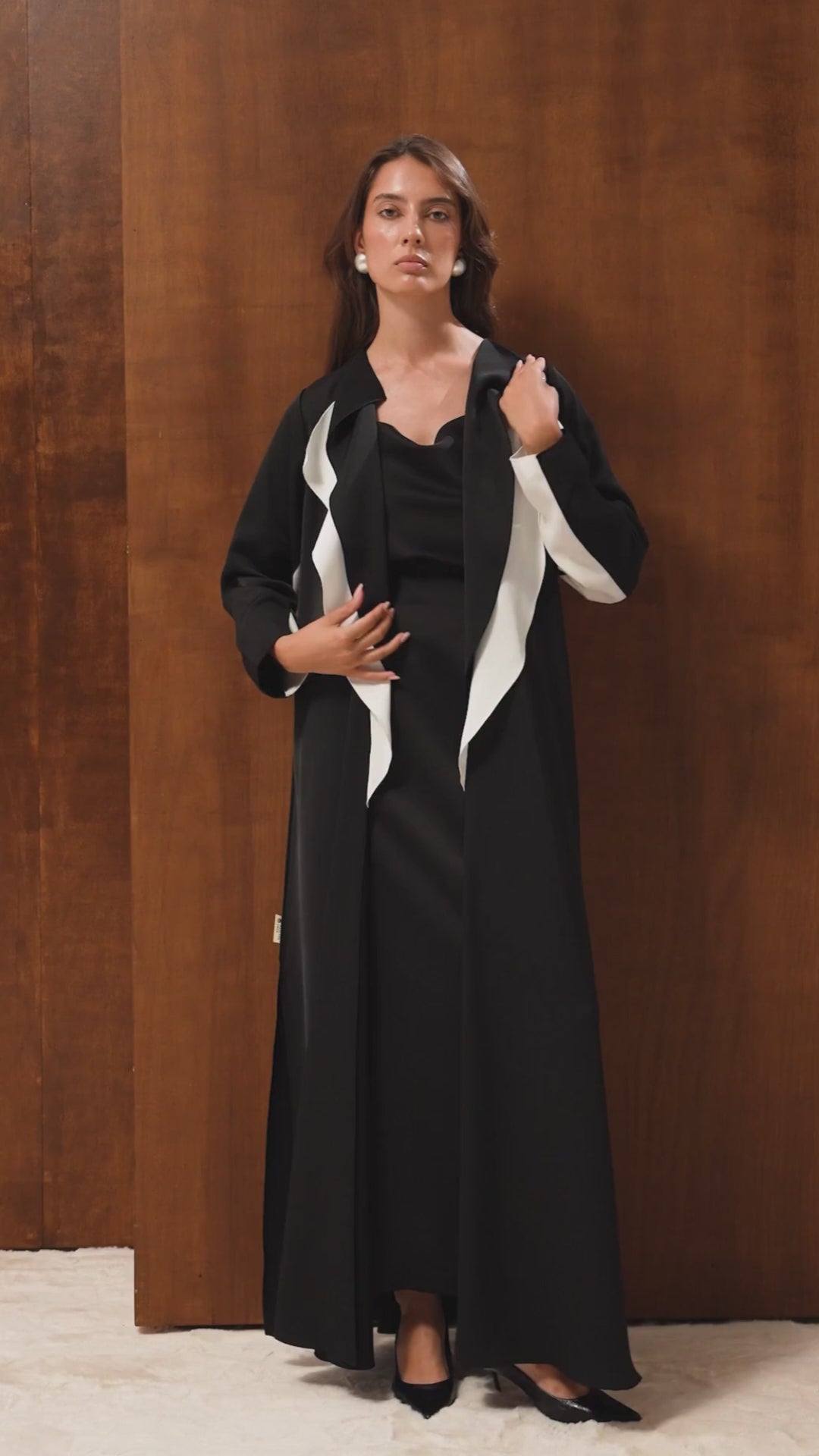 Video of the Monochrome abaya by Selected Lines — black shiny Japanese crepe with a minimalist white wave design
