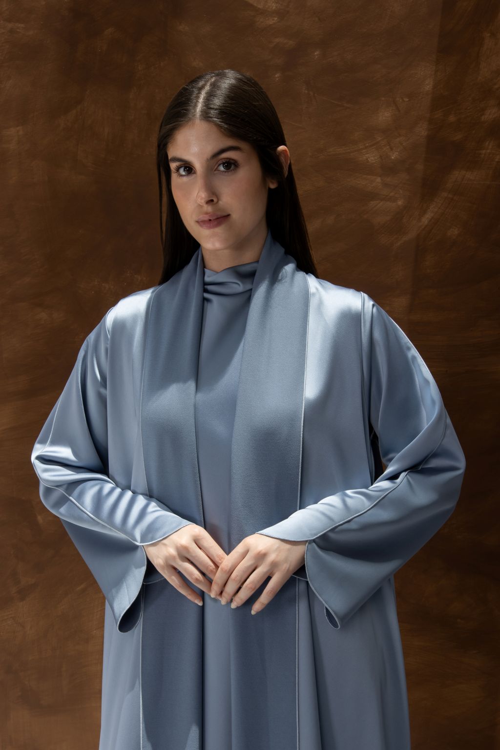 Selected Lines silhouette abaya with refined design in soft blue fabric worn by model