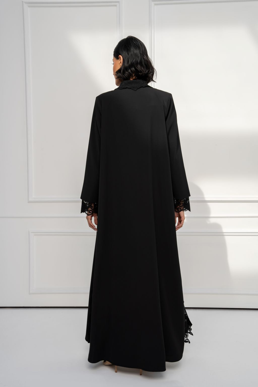 Selected Lines Solenne collar abaya in black with lace detailing and a flowing design, perfect for elegant occasions.