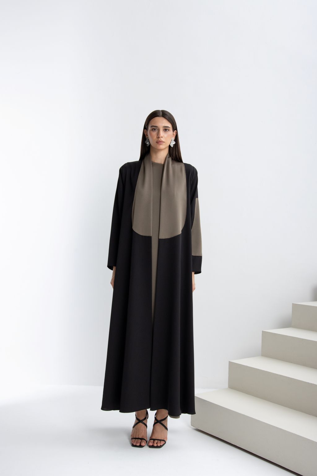 Elegant timeless handcrafted abaya featuring a chic color block design, perfect for any occasion.