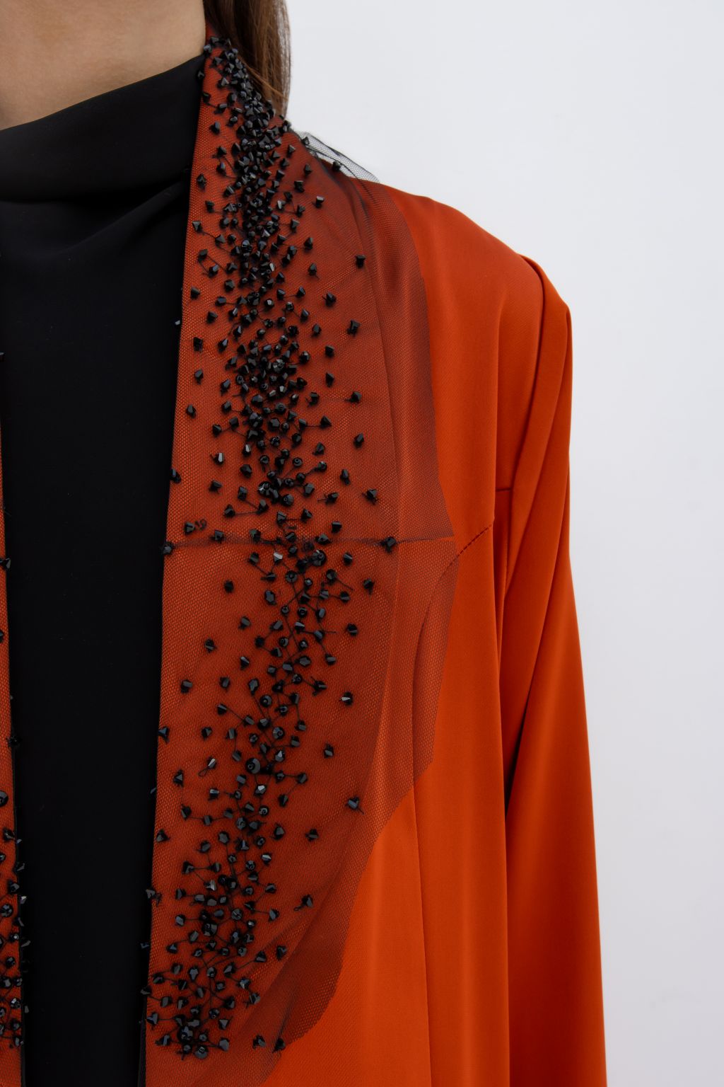 Selected Lines elegant tulle evening abaya in burnt orange with black bead embellishments on sheer fabric